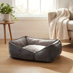 Gray flat orthopaedic dog bed with cushioned sides and inner quilted mattress