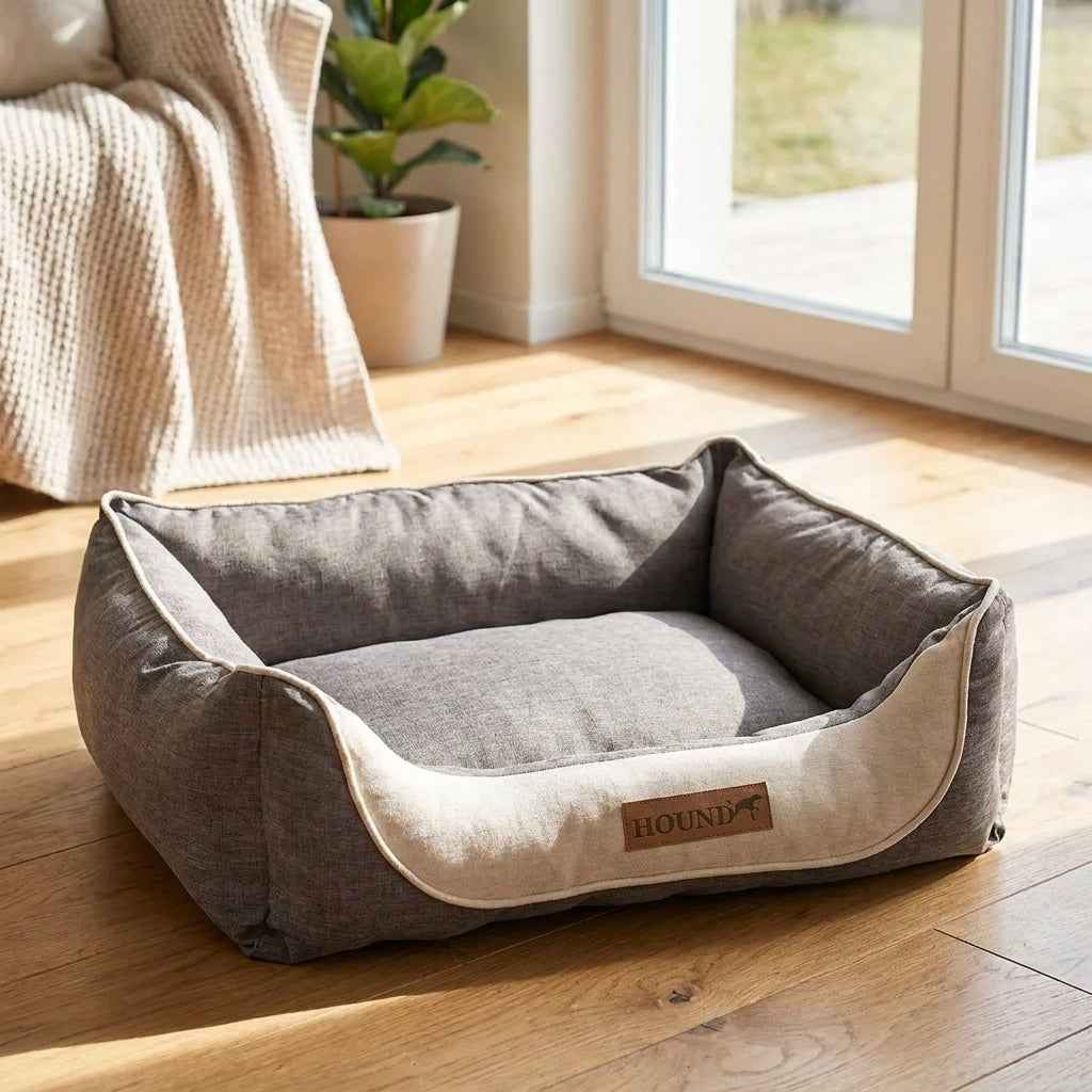 Gray and beige fabric dog bed with raised sides and removable cushioned base