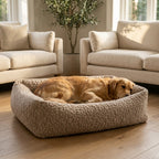 Beige corduroy orthopaedic pet bed with cushioned bolsters and textured fabric; brown dog resting