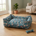 Floral bolster pet bed in teal-blue with oval shape and bolster side walls