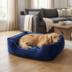 Blue velvet pet nest bed with raised sides, red-golden dog sleeping inside