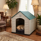 White plastic dog house with green roof and arched entrance; dog lying inside