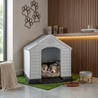 Raised plastic dog kennel with ramp, white arched door; dog on gray bed cushion.
